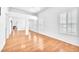 Bright bedroom featuring hardwood floors, white walls, and mirrored closet doors at 8985 S Durango Dr # 1110, Las Vegas, NV 89113