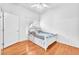 Bedroom featuring hardwood floors and a window with blinds at 8985 S Durango Dr # 1110, Las Vegas, NV 89113
