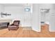 Entryway boasts hardwood floors, white walls, and a door to the bedroom at 8985 S Durango Dr # 1110, Las Vegas, NV 89113