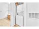 Compact laundry room with a stacked washer and dryer unit and tiled floors at 8985 S Durango Dr # 1110, Las Vegas, NV 89113