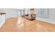 Living room features hardwood floors, plantation shutters, and a brown sofa at 8985 S Durango Dr # 1110, Las Vegas, NV 89113