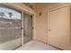 Private patio with sliding glass door access and a tan door at 8985 S Durango Dr # 1110, Las Vegas, NV 89113