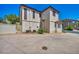 Back exterior view of home with air conditioning units and landscaped yard at 9165 Starling Wing Pl, Las Vegas, NV 89143