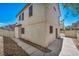 Exterior back corner view of home with patio access at 9165 Starling Wing Pl, Las Vegas, NV 89143