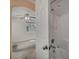 Bathroom with tiled tub/shower and neutral paint at 9165 Starling Wing Pl, Las Vegas, NV 89143