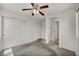 Bedroom with closet, ceiling fan, carpet flooring, and neutral walls at 9165 Starling Wing Pl, Las Vegas, NV 89143