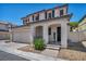 Charming two-story home with a two-car garage and covered front porch entry at 9165 Starling Wing Pl, Las Vegas, NV 89143