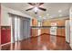 Bright kitchen boasting wood cabinets, granite countertops, white appliances, and hardwood floors at 9165 Starling Wing Pl, Las Vegas, NV 89143