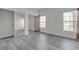 Bright bedroom features gray floors, white walls, and mirrored closet doors at 9330 W Maule Ave # 212, Las Vegas, NV 89148
