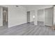 Bright bedroom features gray floors, white walls, and mirrored closet doors at 9330 W Maule Ave # 212, Las Vegas, NV 89148