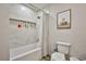 Neutral bathroom featuring a shower-tub combo with tiled surround and a built-in niche at 9340 W Washburn Rd, Las Vegas, NV 89149