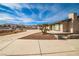 Single-story home with desert landscaping, circular driveway, and mountain views at 9340 W Washburn Rd, Las Vegas, NV 89149