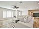 Comfortable living room with large windows, inviting natural light and pleasant views at 9340 W Washburn Rd, Las Vegas, NV 89149
