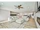 Bright and airy living room boasts wood floors and stylish decor, including a comfortable sectional at 9340 W Washburn Rd, Las Vegas, NV 89149