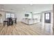 Open concept living area with a dining area, a living room, and a front entryway with tons of light at 9340 W Washburn Rd, Las Vegas, NV 89149