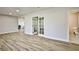 Bright living space features light wood floors and access to bathroom at 9340 W Washburn Rd, Las Vegas, NV 89149