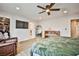 Spacious main bedroom with hardwood floors, ceiling fan, and large walk-in closet at 9340 W Washburn Rd, Las Vegas, NV 89149