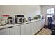 Convenient pantry features ample counter space and custom cabinetry for organized storage at 9340 W Washburn Rd, Las Vegas, NV 89149