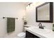 Cozy bathroom with a framed mirror and a white vessel sink at 9404 Calico Garden Ave, Las Vegas, NV 89134