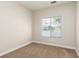 Neutral bedroom with standard window and base trim at 9404 Calico Garden Ave, Las Vegas, NV 89134