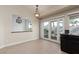 A well-lit dining room featuring a view to the green backyard at 9404 Calico Garden Ave, Las Vegas, NV 89134
