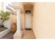 Charming home entrance with tiled walkway and decorative potted plants by the front door at 9404 Calico Garden Ave, Las Vegas, NV 89134