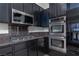 Updated kitchen showcasing stainless steel appliances and granite countertops at 9404 Calico Garden Ave, Las Vegas, NV 89134