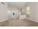 Inviting living room featuring neutral walls, large windows, and an open floor plan at 9404 Calico Garden Ave, Las Vegas, NV 89134
