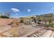 A backyard featuring a large open space with brick accents and a covered patio at 952 Crescent Falls St, Henderson, NV 89011