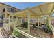 View of the backyard featuring a lattice covered patio area with plantings at 952 Crescent Falls St, Henderson, NV 89011