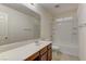 Bathroom featuring a vanity with sink and a shower-tub combo with white tiling at 952 Crescent Falls St, Henderson, NV 89011