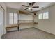 Bedroom with built-in shelving and a desk with plantation shutters on the windows at 952 Crescent Falls St, Henderson, NV 89011