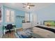 This bedroom offers a ceiling fan, built in shelves, and neutral color palette at 9654 Ponderosa Skye Ct, Las Vegas, NV 89166