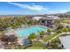 Community pool featuring expansive lounging areas and manicured landscaping for residents' enjoyment at 9654 Ponderosa Skye Ct, Las Vegas, NV 89166