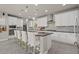 Kitchen featuring granite counters, stainless steel appliances, and an eat-in bar at 9654 Ponderosa Skye Ct, Las Vegas, NV 89166