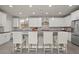 Kitchen featuring granite counters, stainless steel appliances, and an eat-in bar at 9654 Ponderosa Skye Ct, Las Vegas, NV 89166