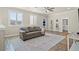 Upstairs living room with hardwood flooring, cozy seating area and ample natural light from shuttered windows at 9654 Ponderosa Skye Ct, Las Vegas, NV 89166