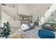 Spacious living room featuring modern staircase, and ample natural light at 9654 Ponderosa Skye Ct, Las Vegas, NV 89166