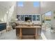 Inviting living room with high ceilings, large windows, and custom shelving for display at 9654 Ponderosa Skye Ct, Las Vegas, NV 89166