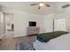 Bright main bedroom with wood floors, ceiling fan and a walk in closet at 9654 Ponderosa Skye Ct, Las Vegas, NV 89166