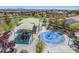 Community playground features slides, splash pad, and shaded areas for to play and enjoy at 9654 Ponderosa Skye Ct, Las Vegas, NV 89166