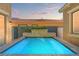 Inviting backyard pool with stone accents and clear blue water, perfect for relaxation and outdoor enjoyment at 9654 Ponderosa Skye Ct, Las Vegas, NV 89166