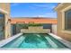 Relaxing backyard pool with stacked stone features and a clear blue surface at 9654 Ponderosa Skye Ct, Las Vegas, NV 89166