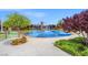 Community splash pad features water features with mature landscaping and a blue, non-slip surface at 9654 Ponderosa Skye Ct, Las Vegas, NV 89166