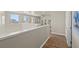 Hallway featuring hardwood floors and neutral tones creates a cozy and inviting transition space at 9654 Ponderosa Skye Ct, Las Vegas, NV 89166