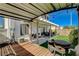 Pergola covered patio, artificial turf, with an outdoor grill and a bench at 9931 Cherry Melee Ave, Las Vegas, NV 89148