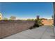 View of the block wall fence and sidewalk in the backyard of the home at 9931 Cherry Melee Ave, Las Vegas, NV 89148