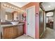 Stylish bathroom boasts a vessel sink, wood vanity, modern lighting, and a barn door entrance at 9931 Cherry Melee Ave, Las Vegas, NV 89148