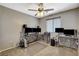 Versatile bedroom configured as an office space with multiple monitors and ample desk space at 9931 Cherry Melee Ave, Las Vegas, NV 89148