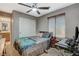 Bedroom featuring ceiling fan, closet, and attached bathroom, offering comfort and convenience at 9931 Cherry Melee Ave, Las Vegas, NV 89148